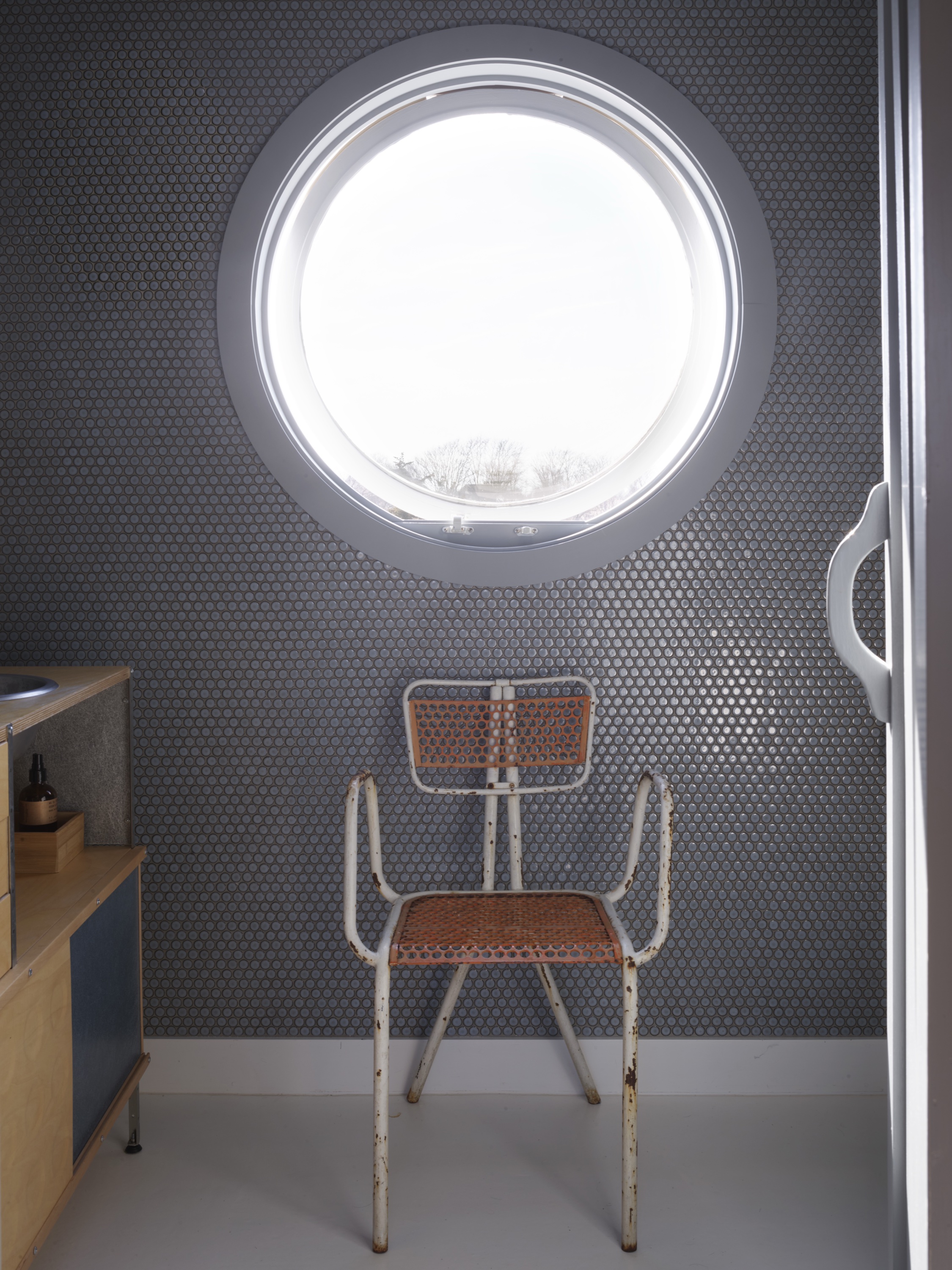 witness locations harbor nest bellport long island bathroom porthole gray tile vintage chair